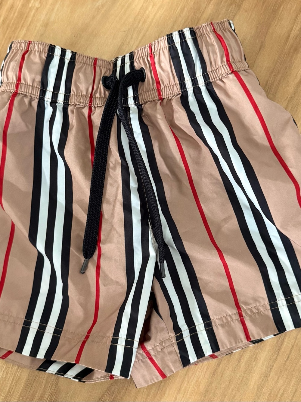 Burberry Tan Striped Swim Trunks with Black, White & Red Accents